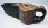Ancient carved stone lamp from the Islamic world with geometric detailing and a projecting spout designed for a wick.