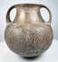 Ancient Etruscan terracotta amphora showing its rounded body, high loop handles, short neck, and dark impasto surface.