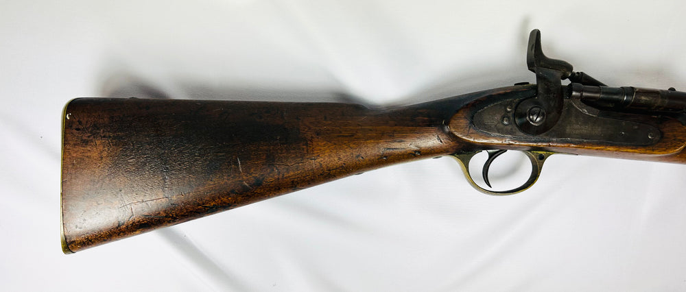 Close-up of the walnut stock and 1864 Enfield lockplate with Victoria cypher on the Snider-Enfield Mk II rifle.