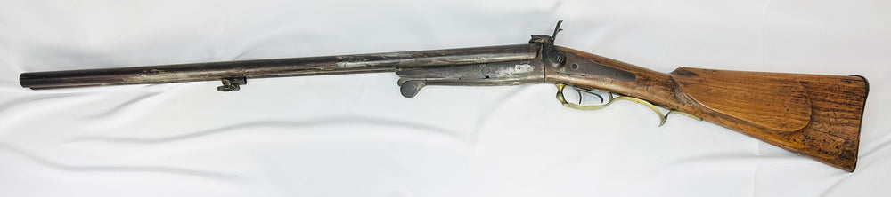 Historic French underlever shotgun illustrating early cartridge firearm technology