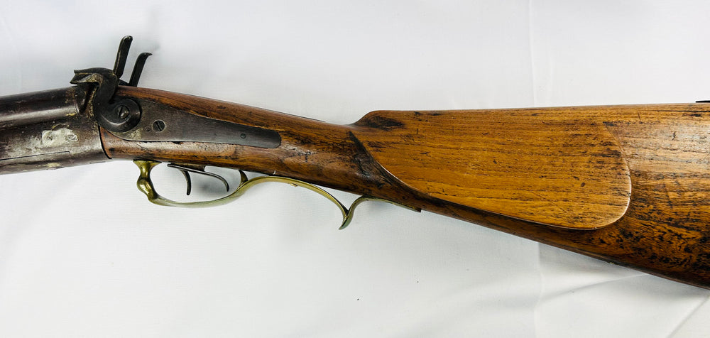 Mid-19th century French underlever pinfire shotgun with walnut stock and brass trigger guard