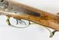 Antique French pinfire shotgun featuring double barrels, exposed hammers, and break-action design
