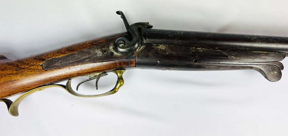 European 19th century pinfire shotgun with break-action and double triggers