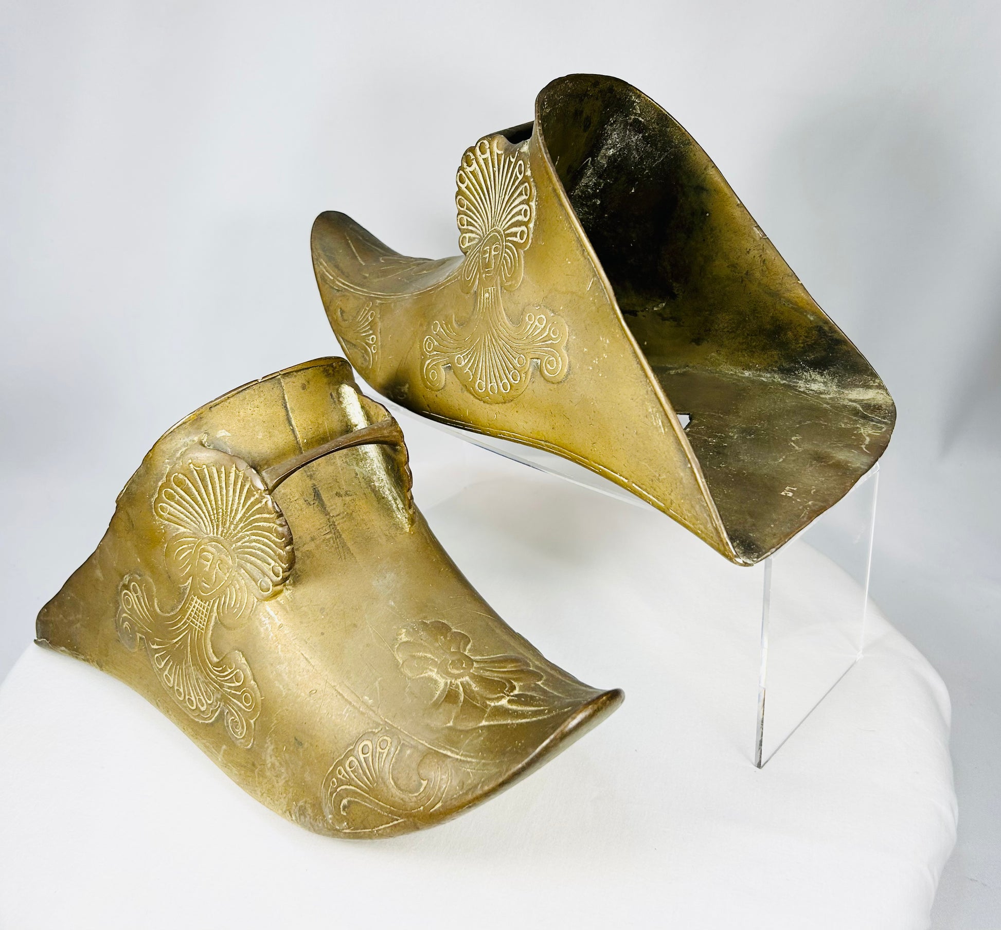 Cast brass Conquistador-style slipper stirrups with sculptural headdress figure decoration.