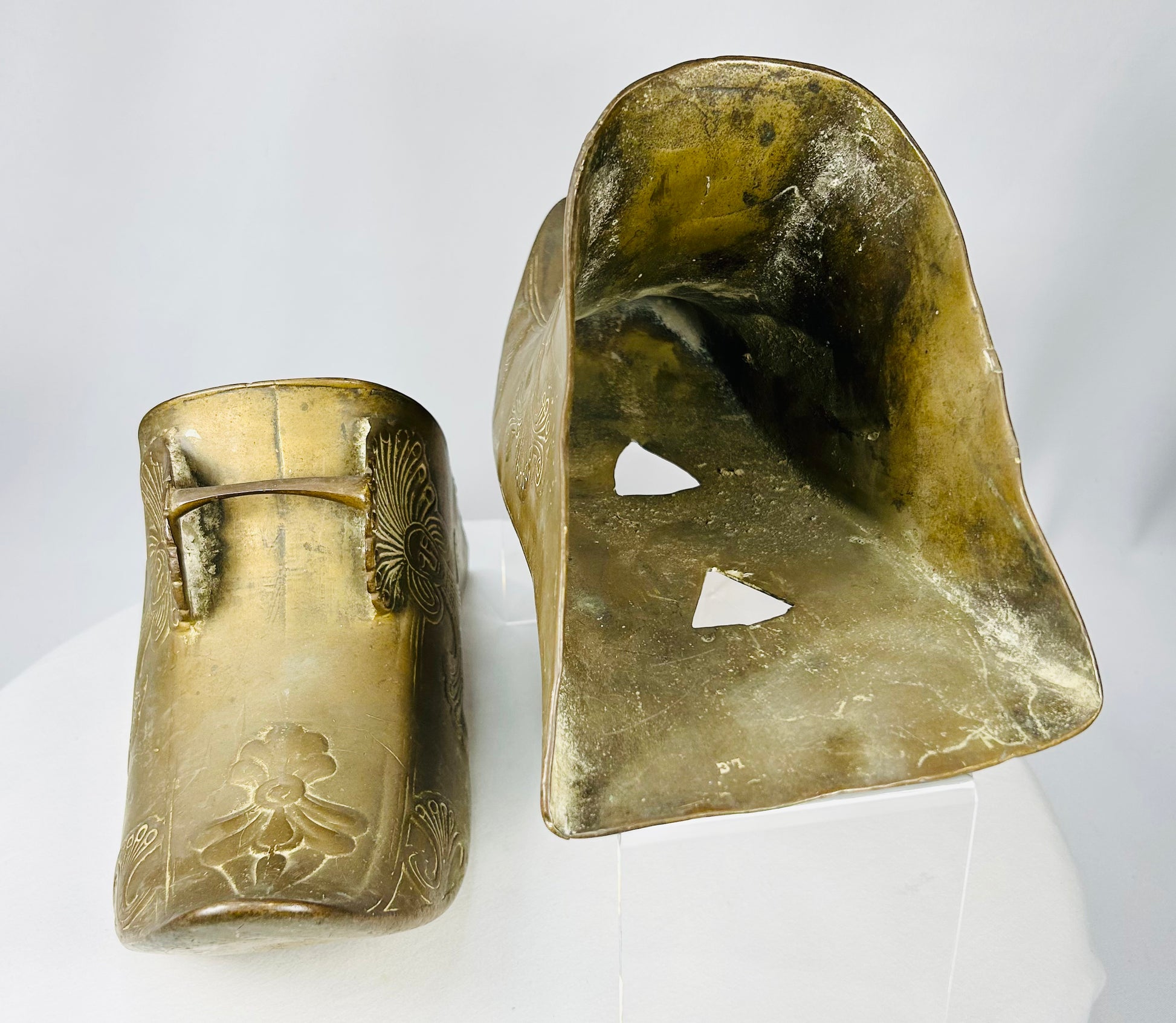 Pair of Spanish Colonial brass stirrups showing traditional enclosed foot protection design.