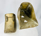 Pair of Spanish Colonial brass stirrups showing traditional enclosed foot protection design.