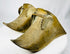 Antique equestrian brass slipper stirrups combining Colonial and Indigenous artistic influences.