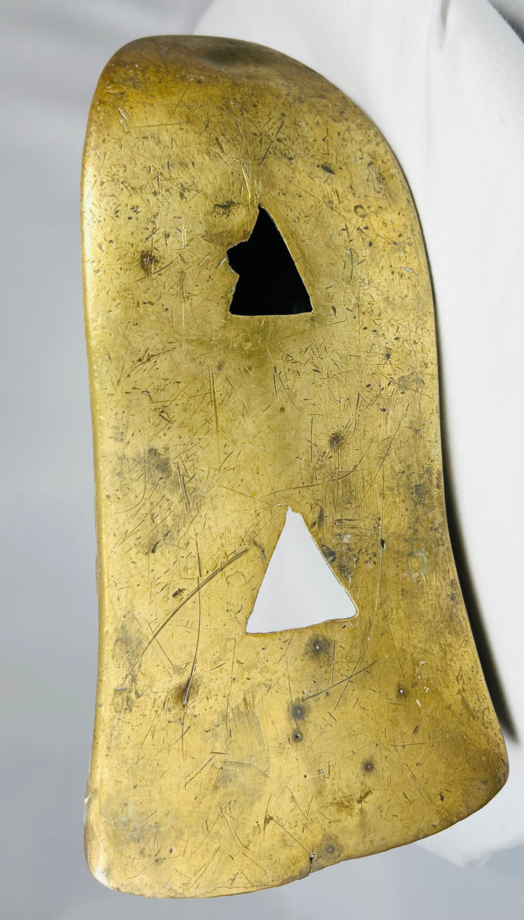 Antique cast brass slipper stirrups with enclosed toe and relief ornamental detailing.