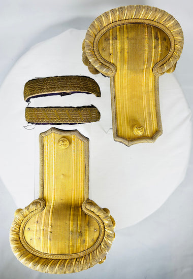 Original late 19th-century naval officer epaulettes with preserved textile backing and case