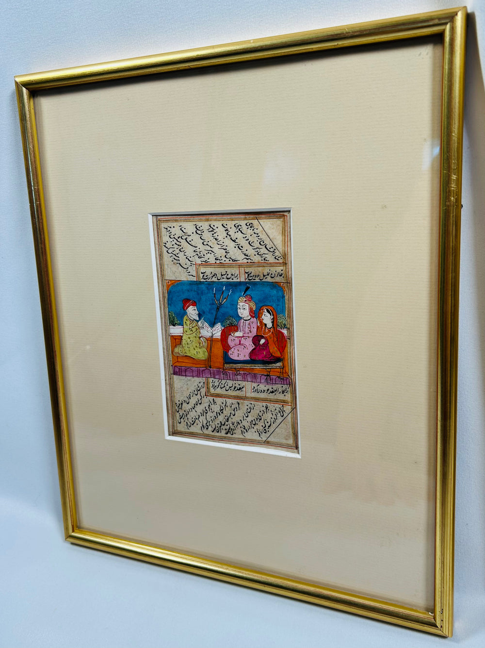 Antique Indo-Persian manuscript illustrations combining poetry and court scenes