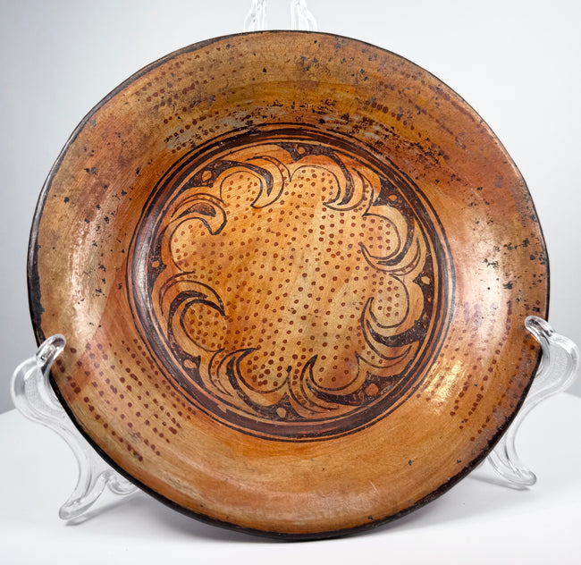 Front view of Greater Nicoya Pre-Columbian ceramic bowl with dotted radial and scrolling painted motifs