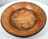 Side perspective of ancient Greater Nicoya pottery plate showing broad shallow form and raised rim
