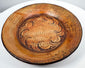Side perspective of ancient Greater Nicoya pottery plate showing broad shallow form and raised rim