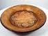 Detailed view of Pre-Columbian painted ceramic bowl with dotted field and inward-curving scroll motifs