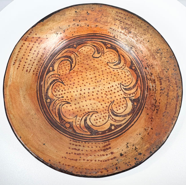 Oblique view of Pre-Columbian Central American ceramic bowl displaying painted interior and shallow profile