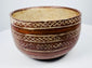 Red-brown pottery bowl with cream lattice patterns arranged in horizontal bands.