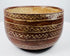 Decorated earthenware bowl with repeating X-shaped motifs and a pale buff interior.