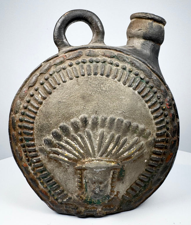 Ancient Peruvian pottery flask with radiating headdress and stepped geometric border