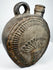 Pre-Columbian Andean flask with abstract relief motifs and worn ceramic surface