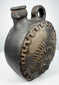 Blackware pottery canteen with integrated handle and anthropomorphic relief