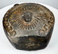 Ancient Peruvian blackware vessel with circular body and prominent loop handle