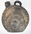 Peruvian ceramic canteen with bold relief decoration and rounded body