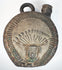 Pre-Columbian blackware flask with geometric patterns and sculptural detailing