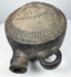 Andean pottery vessel with elaborate headdress imagery and tubular spout