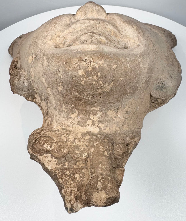 Veracruz Sonriente smiling face sculpture with weave-like motifs across the ceremonial headdress