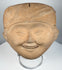 Classic Veracruz terracotta Sonriente head with broad smiling expression and elaborate ceremonial headdress