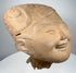 Classic Veracruz smiling face terracotta head with prominent scroll and geometric headdress motifs