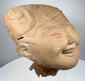 Classic Veracruz smiling face terracotta head with prominent scroll and geometric headdress motifs