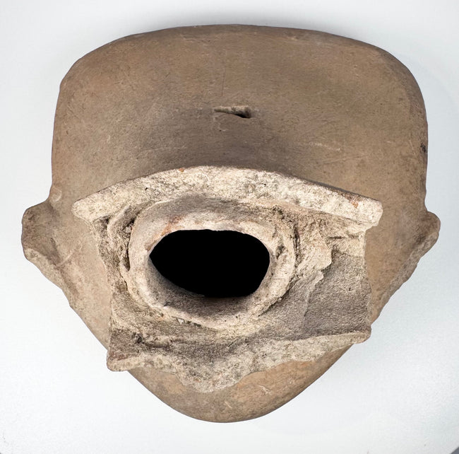 Pre-Columbian Veracruz smiling figure head with expressive face and sculpted scroll-motif headdress, circa 600–900 CE
