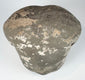 Fragmentary Ming Dynasty terracotta human head with weathered grey, cream and earthy coloration