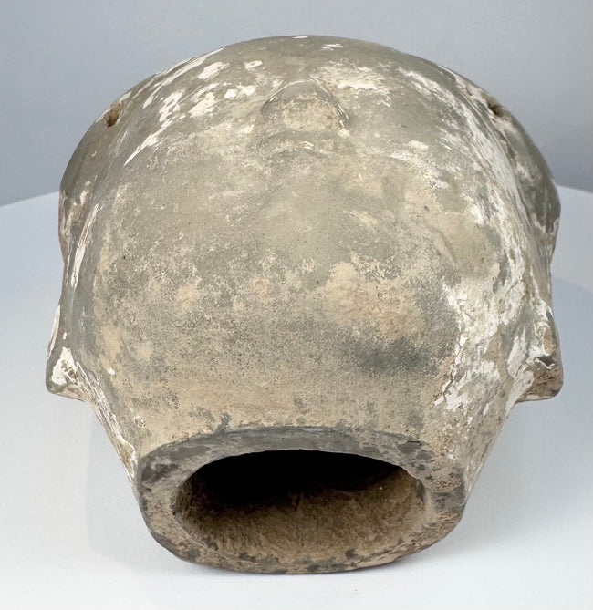 Ancient Chinese ceramic head from a larger sculptural figure with pale coating remnants and age-related wear