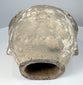Ancient Chinese ceramic head from a larger sculptural figure with pale coating remnants and age-related wear