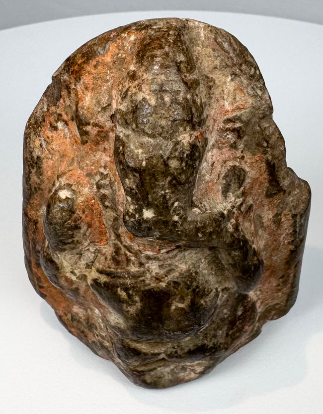Antique Indian Ganesha stone carving with elephant-headed form and shrine-like architectural surround