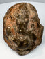 Antique Indian Ganesha stone carving with elephant-headed form and shrine-like architectural surround