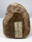 Antique Hindu Ganesha figure carved in sandstone with pink pigment remnants and weathered surface