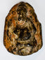 Indian religious stone sculpture of Ganesha with compact form and deeply carved surrounding details