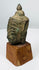 Thai Buddhist bronze sculpture fragment with serene facial features and pointed ushnisha finial