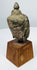 Thai devotional Buddha head with elongated earlobes, softened facial modelling and mineralized surface
