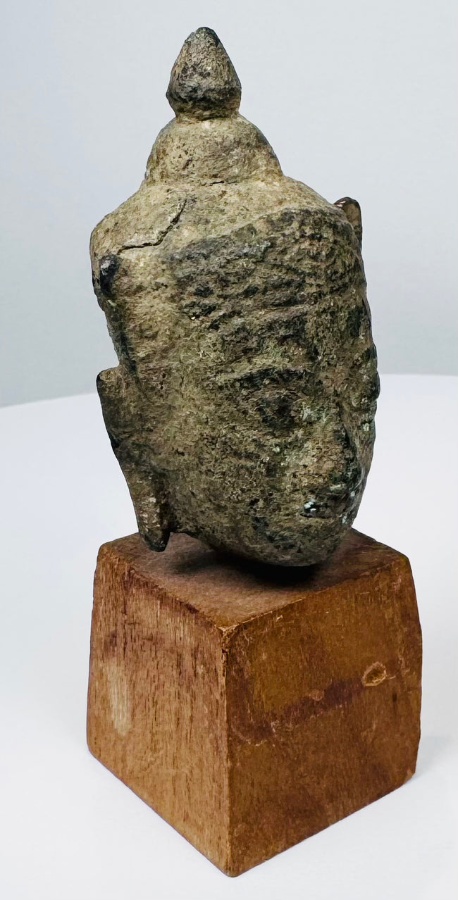 Antique Southeast Asian bronze Buddha head with pointed finial and heavily aged archaeological patina