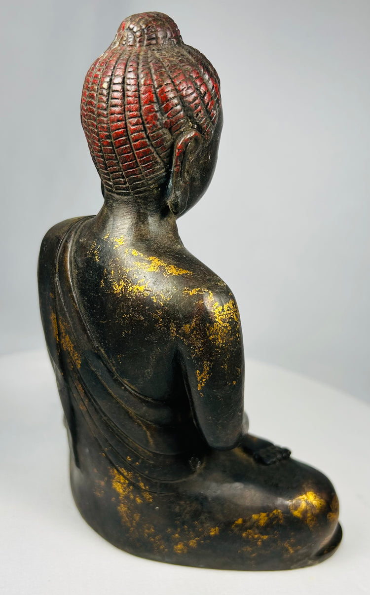 Chinese meditation Buddha sculpture with flowing robe folds and aged surface