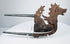 Iron areca nut cutter from Indonesia with dragon-lion creature and silver-covered tapering handles