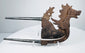 Iron areca nut cutter from Indonesia with dragon-lion creature and silver-covered tapering handles