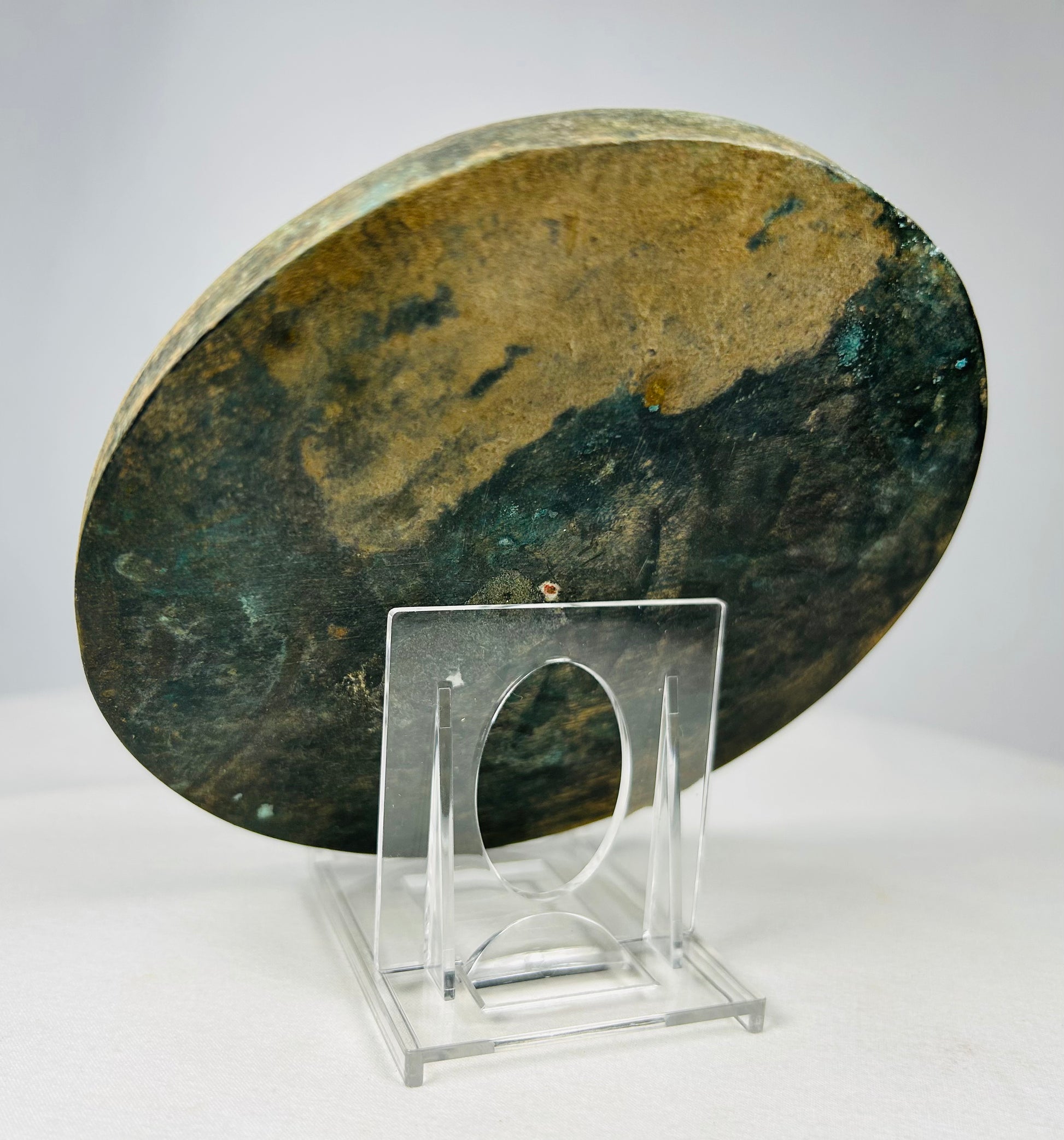 Tang style bronze mirror showing aged green and brown patina