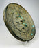 Chinese bronze mirror displaying intricate sea creature ornamentation