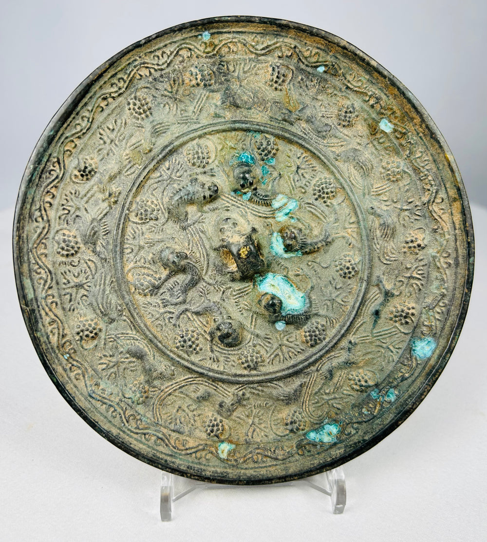 Circular Tang style bronze mirror with mineral encrusted patina surface