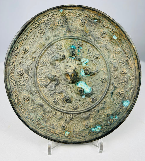 Circular Tang style bronze mirror with mineral encrusted patina surface